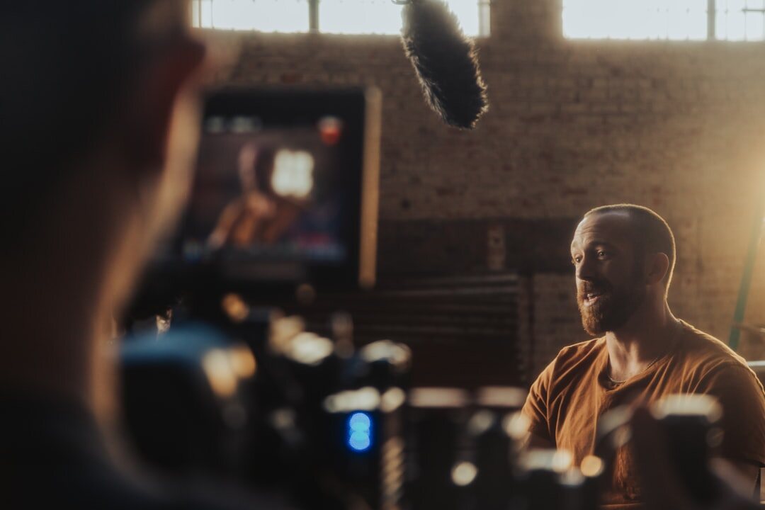 Two people having a business interview on a TV set