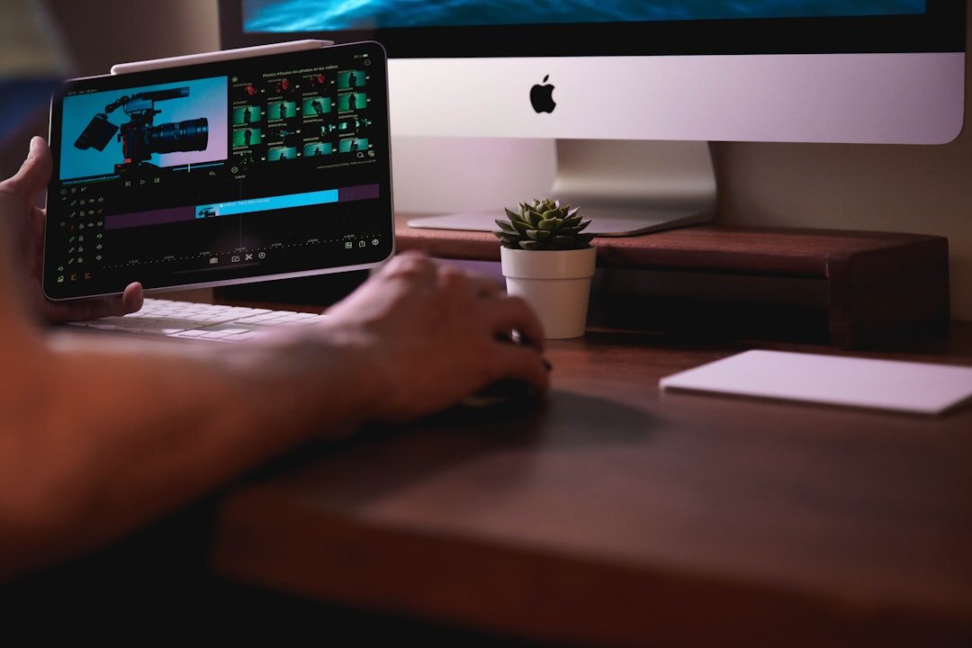 Video editor working on business show footage at a desk